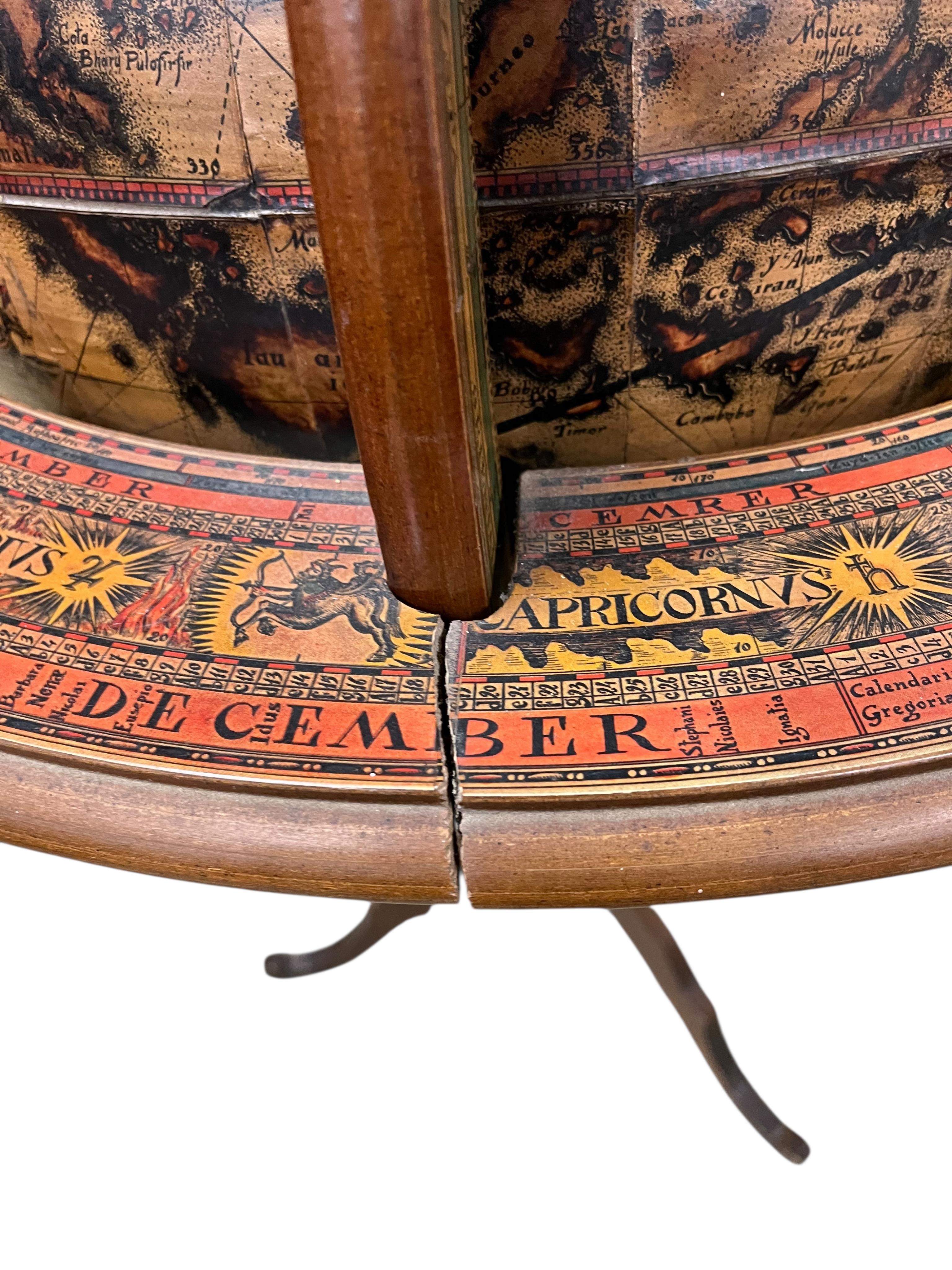 A reproduction terrestrial globe on beech tripod, height 118cm